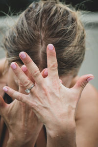 Close-up of woman with hand