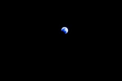 Low angle view of moon against sky at night