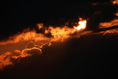 Low angle view of cloudy sky at sunset