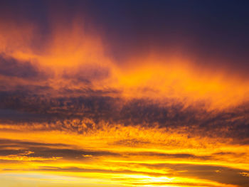 Low angle view of dramatic sky during sunset