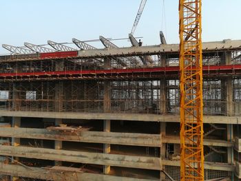 Low angle view of construction site against sky
