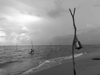 View of calm beach against the sky