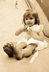 Portrait of cute girl sitting