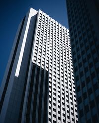 Low angle view of modern buildings against clear sky