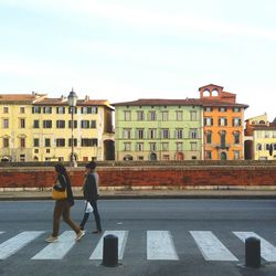 Buildings in city against sky