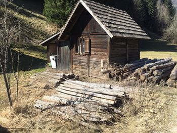 Wooden house on field