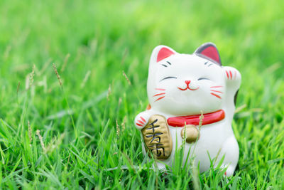 Close-up of figurine toy on field