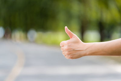 Cropped hand of person gesturing outdoors