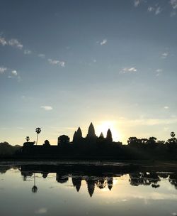 Silhouette of building at sunset