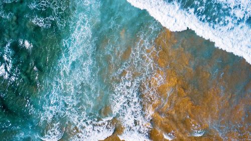 High angle view of water splashing in sea