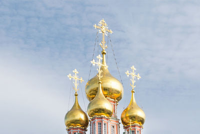 View of the golden domes of the orthodox church against the sky.