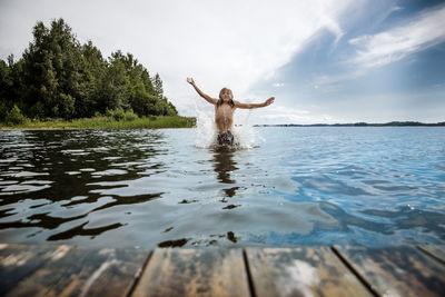 Boy splashing in sea