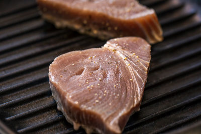 High angle view of meat on barbecue grill