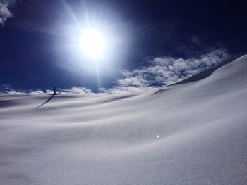 Scenic view of snow covered mountains against sky