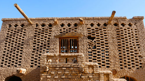 Low angle view of historical building against clear sky