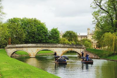 View of arch bridge over river against sky