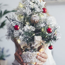 Close-up of hand holding bouquet