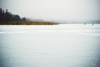 Scenic view of snow covered landscape against sky