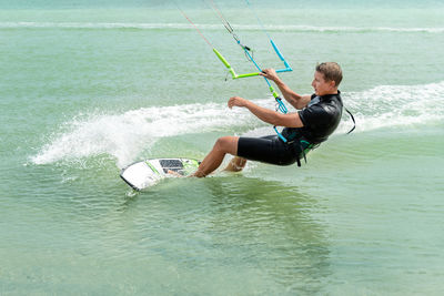 Full length of man surfing in sea