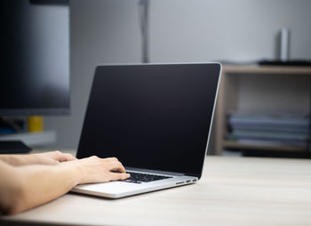 Man using laptop on table