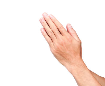 Close-up of hand against white background