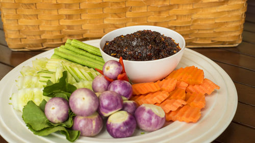 High angle view of fruits in basket on table