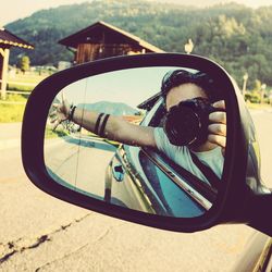 Reflection of car on side-view mirror