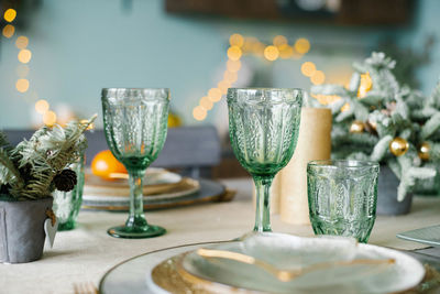 Green glass glasses for a festive christmas dinner