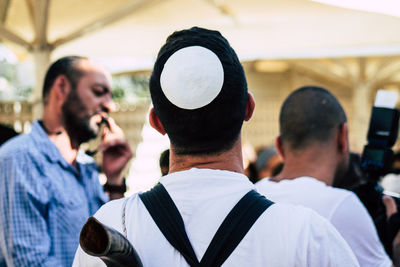 Rear view of man wearing cap