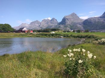 Scenic view of lake and mountains against sky