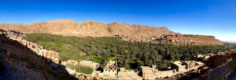 Panoramic view of townscape against clear blue sky