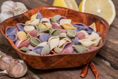 High angle view of pasta with garlic and lemon on table