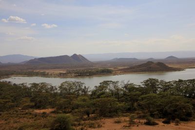 Scenic view of lake against cloudy sky