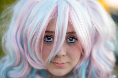 Close-up portrait of teenage girl with dyed hair