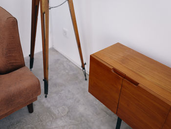 High angle view of man sitting on chair