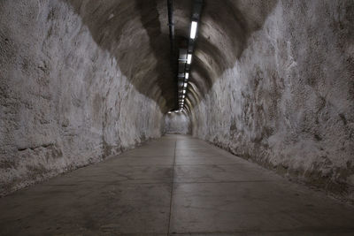 Empty illuminated underground walkway