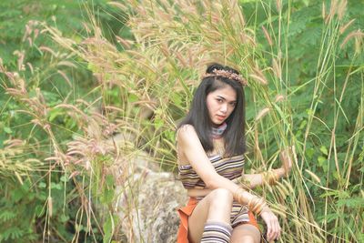 Portrait of a young woman in grass