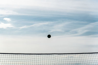 Volleyball flying over net