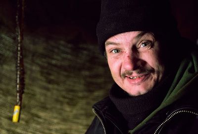 Portrait of smiling man in snow