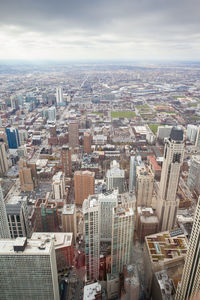 High angle view of modern buildings in city against sky