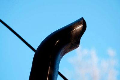 Low angle view of grid structure against clear blue sky