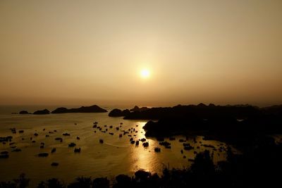 Scenic view of sea against clear sky during sunset