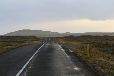 Road amidst landscape against sky