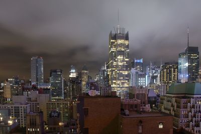 Illuminated buildings in city at night