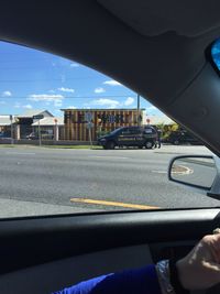 Cropped image of car on road