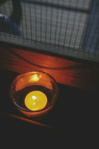 High angle view of illuminated lamp on table
