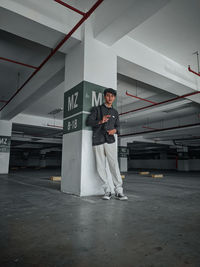 Full length of man standing in factory