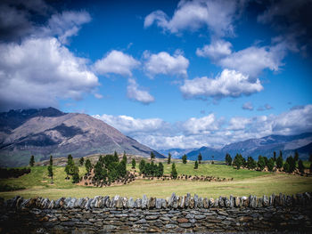 Scenic view of mountains against cloudy sky