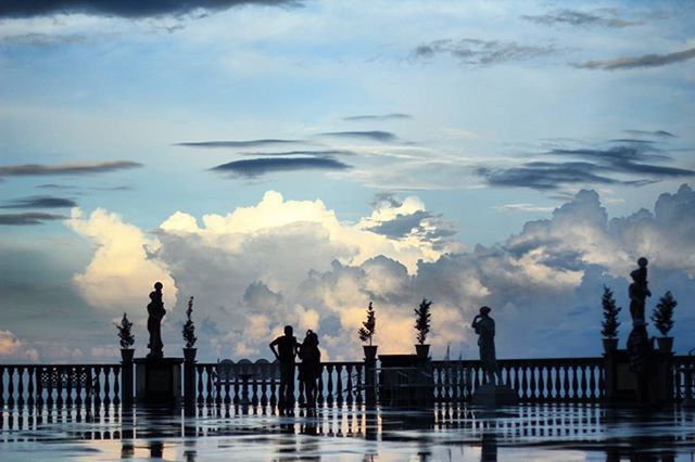 sky, water, cloud - sky, silhouette, railing, sea, cloud, cloudy, nature, pier, built structure, scenics, tranquility, tranquil scene, beauty in nature, men, architecture, outdoors, dusk