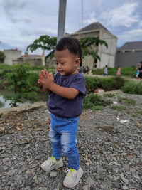 Boy standing outdoors